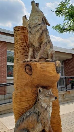 Tree sculpture of coyotes